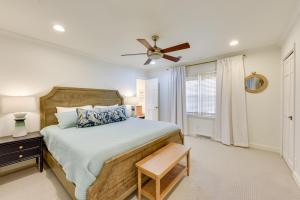a bedroom with a bed and a ceiling fan at 3 Mi to Beach Coastal Escape in Mount Pleasant in Charleston