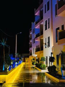 an empty street in a city at night at Lusail in Beni Mellal