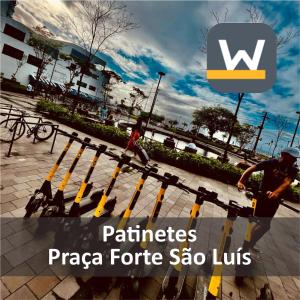 a man standing next to a row of bike racks at H70-Hostel 70 FLORIPA in Florianópolis