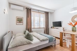 Ένα ή περισσότερα κρεβάτια σε δωμάτιο στο MW 3A Apartamenty