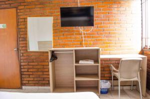 TV a/nebo společenská místnost v ubytování Hotel Elimar