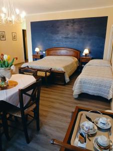 Postel nebo postele na pokoji v ubytování Domus Langhe B&B