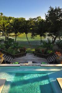 a swimming pool with a view of a resort at Mahogany Hall Luxury Boutique Resort in San Ignacio