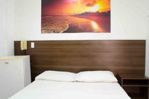 Postel nebo postele na pokoji v ubytování Hotel Elimar