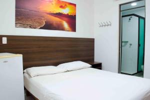 Postel nebo postele na pokoji v ubytování Hotel Elimar