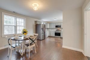 a kitchen with a table and chairs and a refrigerator at Virginia Getaway Near Douthat State Park in Clifton Forge