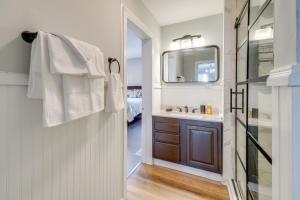 a bathroom with a sink and a mirror at Virginia Getaway Near Douthat State Park in Clifton Forge
