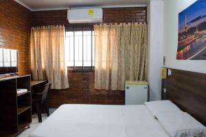 Postel nebo postele na pokoji v ubytování Hotel Elimar