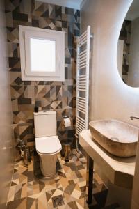 a bathroom with a sink and a toilet at DON Luxury Living Volos in Volos +43 photos
