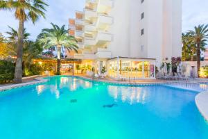 a large swimming pool in front of a hotel at Aparthotel Cap De Mar in Cala Bona