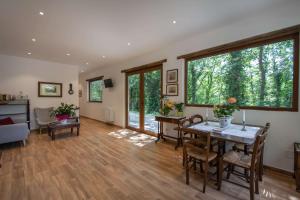 a living room with a table and chairs at Castello Santa Cristina in Grotte di Castro