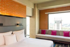Postel nebo postele na pokoji v ubytování Hotel Guadalajara Country Club by HNF + 37 fotografií