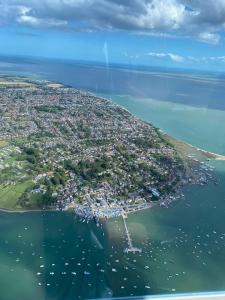 an aerial view of a small island in the water at Island Retreat with HotTub in West Mersea