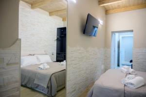 Postel nebo postele na pokoji v ubytování Criba Rooms