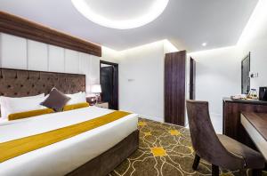 Vuode tai vuoteita majoituspaikassa Ahad Rafidah Garden Millennium Hotel