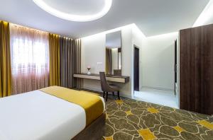 Vuode tai vuoteita majoituspaikassa Ahad Rafidah Garden Millennium Hotel