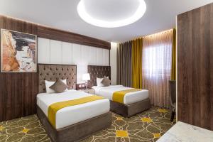 Vuode tai vuoteita majoituspaikassa Ahad Rafidah Garden Millennium Hotel