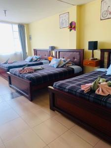 Letto o letti in una camera di Dos Hemisferios