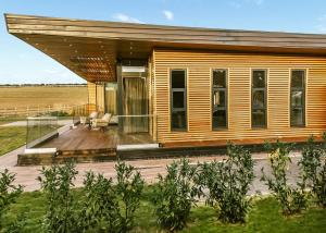 a wooden house with a deck and a porch at Goosedale Lodges in Nottingham +53 photos