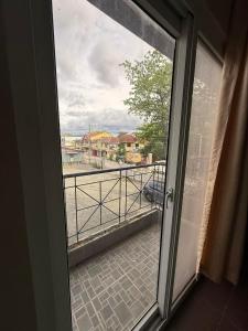 a sliding glass door with a view of a balcony at Subic Bay Baloy Long Beach Hotel in Olongapo +21 photos