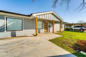 a house with a driveway in front of it at Covered Patio and Private Yard Dallas Area Home in Irving