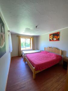 Postel nebo postele na pokoji v ubytování CASA A11 Lago Rapel