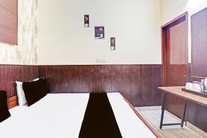 Ένα ή περισσότερα κρεβάτια σε δωμάτιο στο Hotel O cozy suits