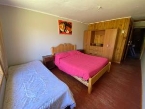 Postel nebo postele na pokoji v ubytování CASA A11 Lago Rapel + 9 fotografií