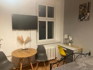 TV a/nebo společenská místnost v ubytování Magnolia Rooms Plus