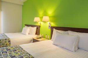 Voodi või voodid majutusasutuse HG Hotel toas
