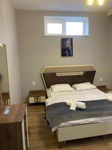 a bedroom with a large bed in a room at Gabala Deluxe 4-bedrooms Villa in Gabala