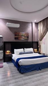 a large bedroom with a large bed in it at شاليهات بالي in Baljurashi +43 photos