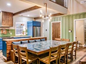 a dining room with a large table and chairs at Copper Cottage French Lick in French Lick