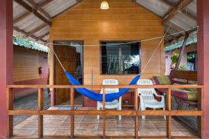 a hammock on the front porch of a house at Family Song Koh Lipe in Ko Lipe