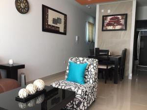 a living room with a chair and a table at Comfortable Durango Apartment in Durango