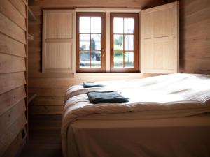 Ένα ή περισσότερα κρεβάτια σε δωμάτιο στο Cozy Cabins in Vencimont