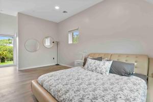 a bedroom with a large bed and a window at Stylish Comfort Wooster Square Yale Wi-Fi in New Haven