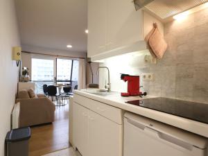 a kitchen with a sink and a counter top at Apartment near Belgian Coast Beach in Oostduinkerke
