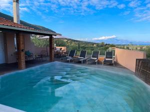 a swimming pool on the roof of a house at Villa in Alykes with Private Pool & Sea Views in Alykes