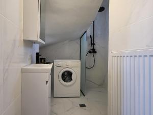 a laundry room with a washing machine and a washer at Villa in Sfakaki with Pool near Beach in Sfakaki