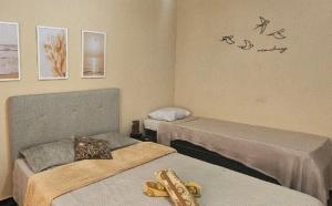 Postel nebo postele na pokoji v ubytování House Beach Brasil
