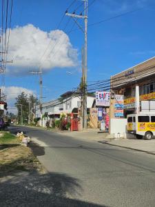 an empty street in a small town with at Mel's Place Batangas Unit 4 Vista De Oro 2 Bedroom House w Free Parking, Google TV WIFI Netflix 4 Guests in Batangas City