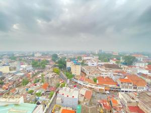 an overhead view of a city with buildings at Fancy and Nice 2BR at Braga City Walk Apartment By Travelio in Bandung