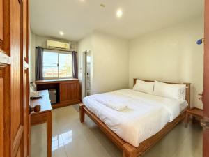 Ένα ή περισσότερα κρεβάτια σε δωμάτιο στο Sea Inn Hua Hin 55