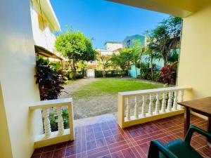 a balcony with a view of a yard at FIESTA HAUS RESORT in Boracay +10 photos