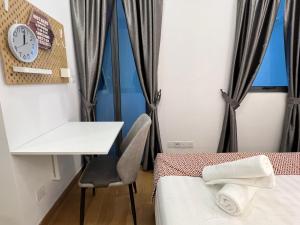 Ein Bett oder Betten in einem Zimmer der Unterkunft The Colony By Infinitum Flixses