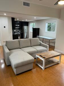 a living room with a couch and a coffee table at Stunning, Quiet Vista Retreat Minutes from Beach in Vista