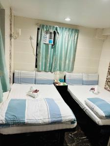 Ένα ή περισσότερα κρεβάτια σε δωμάτιο στο GLOBAL INN RECEPTION FLAT c 4 13 TH FLOOR BLOCK C