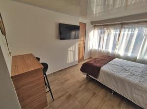 Postel nebo postele na pokoji v ubytování Apartaestudio S201 a 2 calles Milán Urbanevo