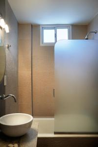 a bathroom with a sink and a refrigerator at Blanro Hotel in Buenos Aires